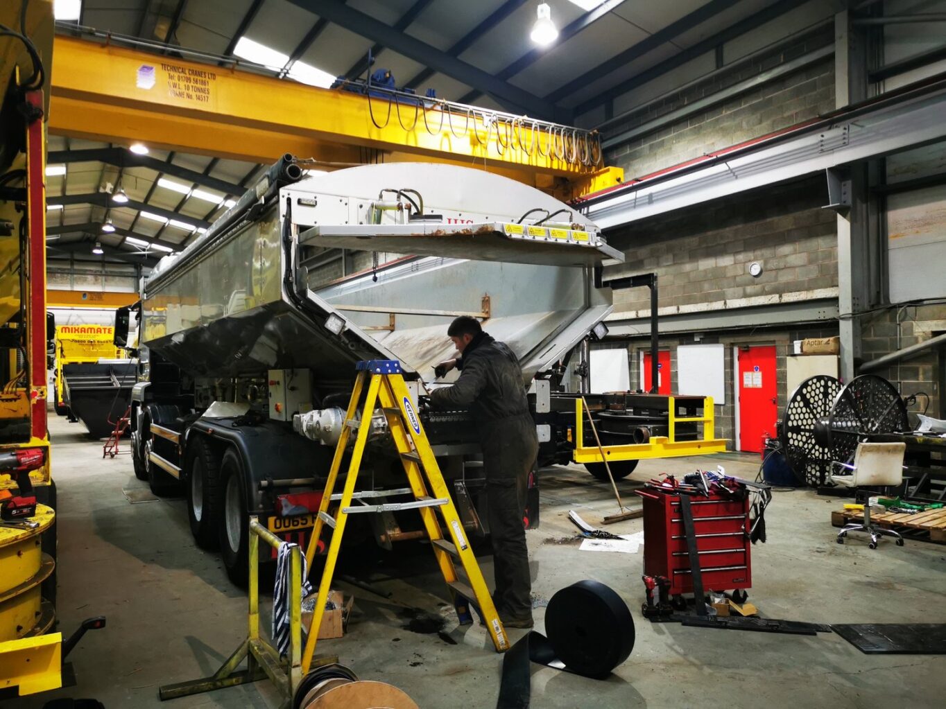 Single Belt Discharge Conveyor Truck undergoing a routine service by one of our skilled engineers